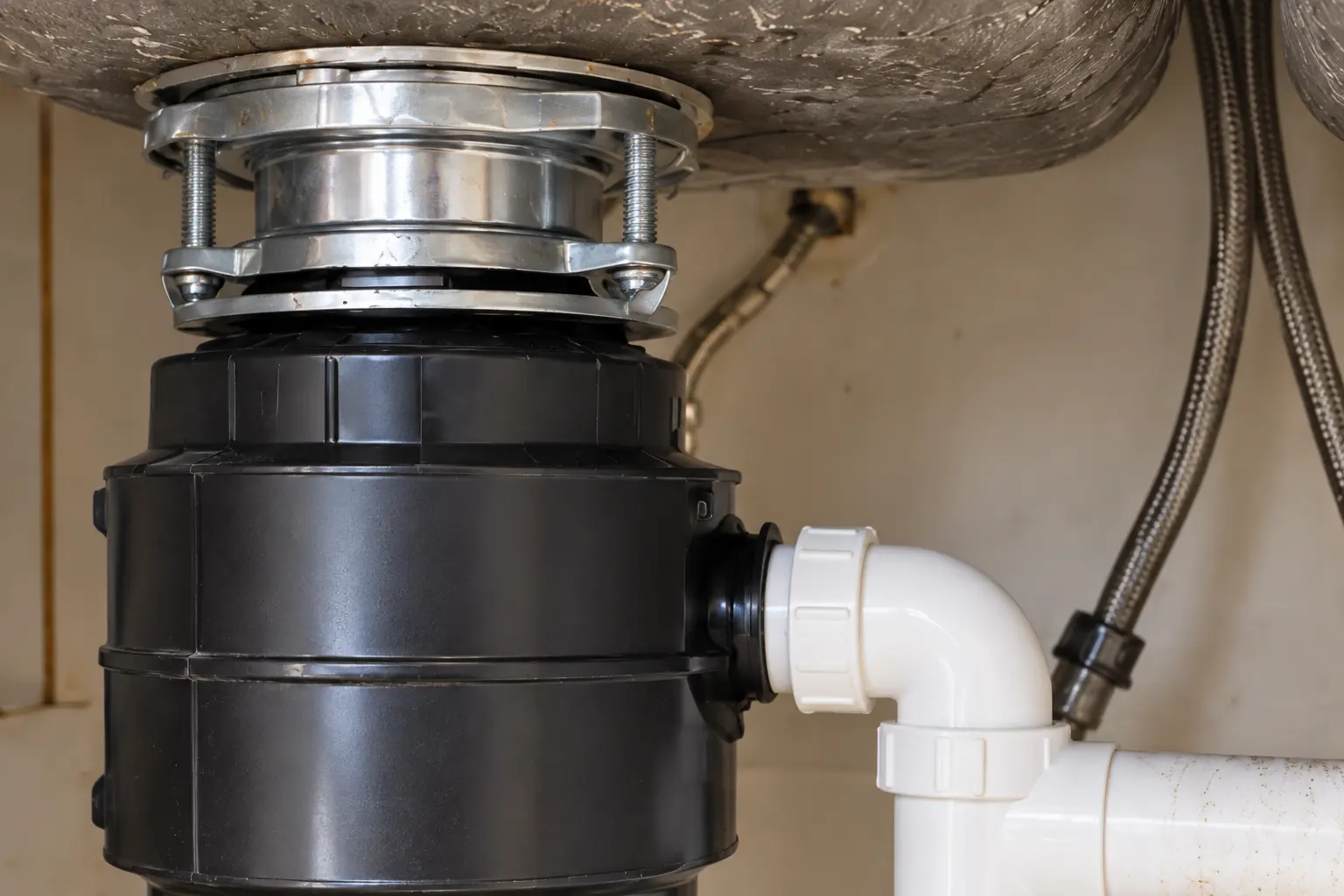 Garbage Disposal Installation & Repair in a 1980s-1990s two-story colonial / tract house — detail