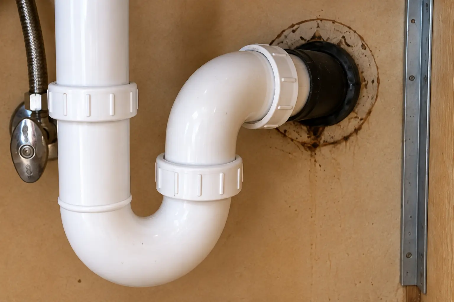 Kitchen Sink Leak & Drain Repair in a 1980s-1990s two-story colonial / tract house — detail