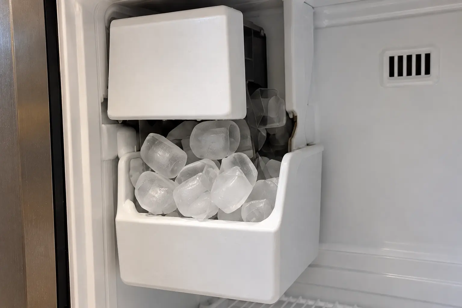 Refrigerator & Ice Maker Repair in a 1980s-1990s two-story colonial / tract house — detail