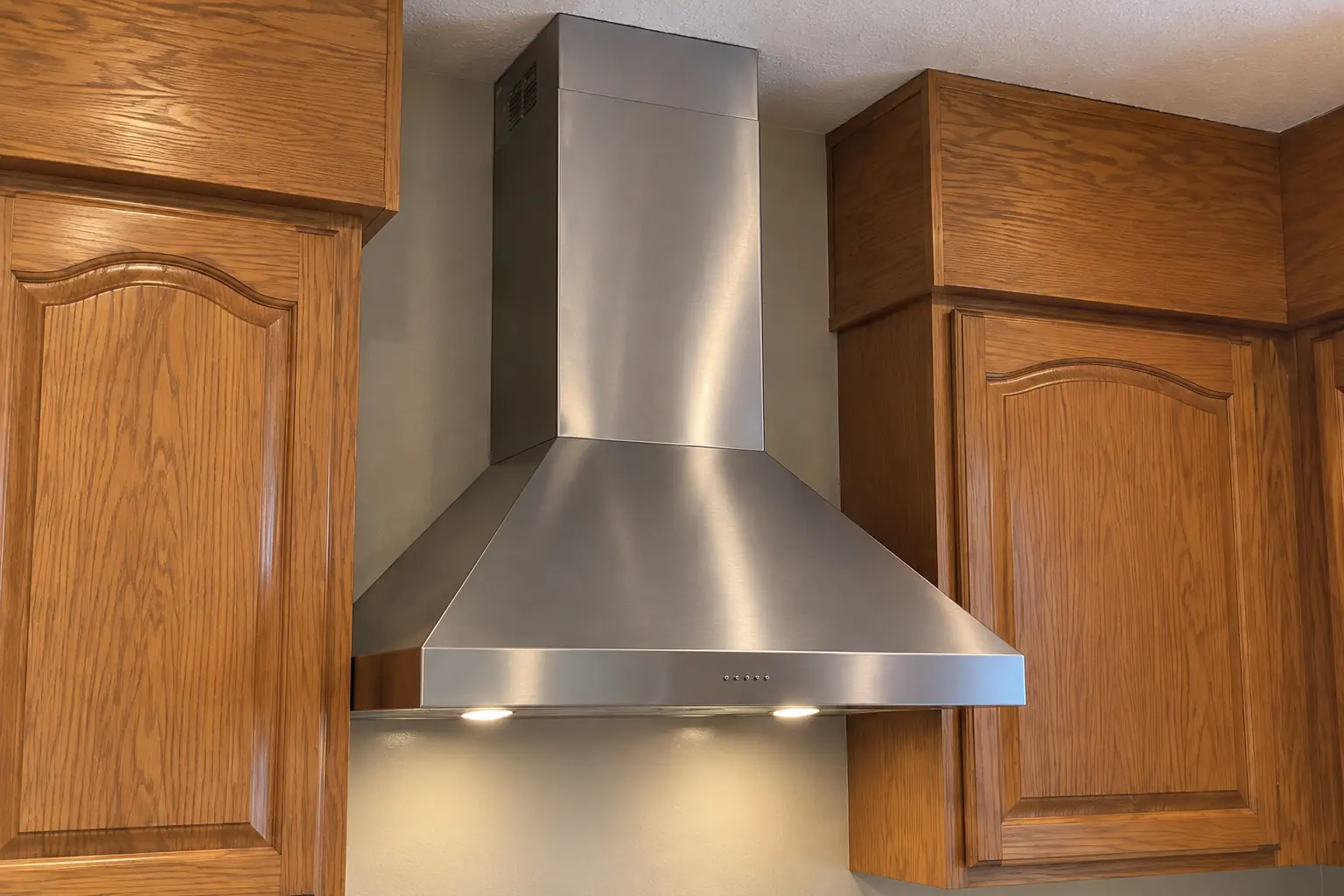 Range Hood Installation in a 1980s-1990s two-story colonial / tract house — detail