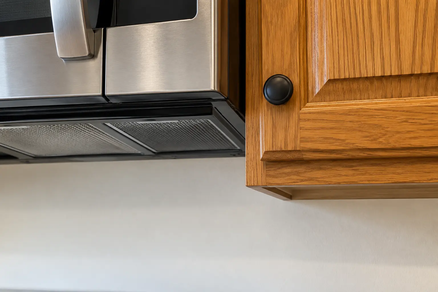 Microwave Installation in a 1980s-1990s two-story colonial / tract house — detail